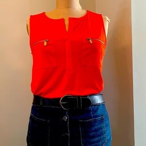 Ellen Tracy orange jersey sleeveless top with zippered patch pockets
